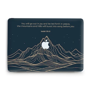 May include: A dark blue laptop skin featuring a gold line-art mountain range design. The center displays a white Apple logo. Above the mountains, the text reads: You will go out in joy and be led forth in peace, the mountains and hills will burst into song before you, Isaiah 55:12.