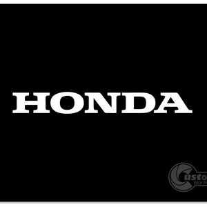 May include: A white Honda logo on a black background.
