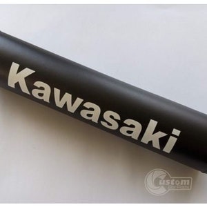 May include: Black handlebar pad with white Kawasaki logo.
