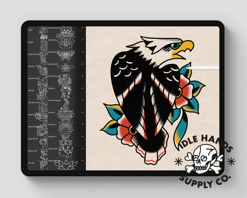 May include: A black and white traditional tattoo flash design of an eagle with red and blue flowers. The design is on a white background with the text "IDLE HANDS SUPPLY CO." in black.