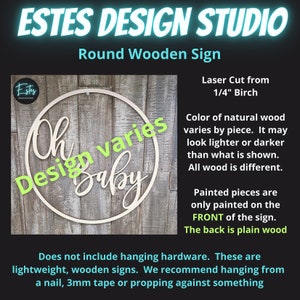 May include: A round wooden sign with the text "Oh Design varies Baby" in a decorative font. The sign is laser cut from 1/4 inch birch wood and is available in natural wood color. The sign is painted on the front and the back is plain wood.