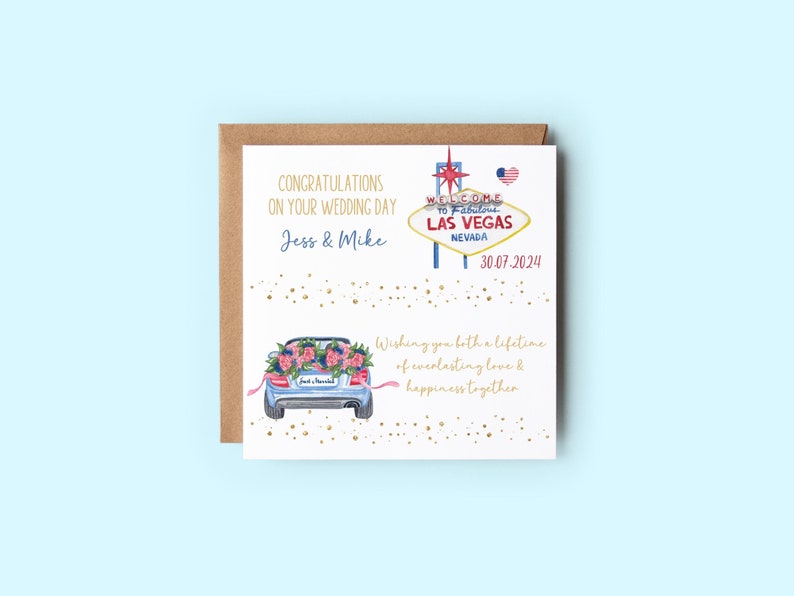 May include: A white card with a gold glitter background and a watercolor illustration of a car with flowers on the back. The card says "Congratulations on your wedding day Jess & Mike" and "Welcome to Fabulous Las Vegas Nevada 30.07.2024". The card also says "Wishing you both a lifetime of everlasting love & happiness together".