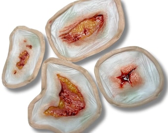 Set of 4 generic infected wounds, silicone prosthetics for Cosplay, LARP, Halloween, and special effects makeup. Latex-free.