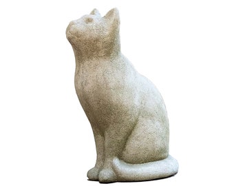 May include: A stone-colored cat statue in a seated position, looking upwards. The sculpture has a textured surface and detailed features, including pointed ears and a curled tail. The cat statue is a decorative item.