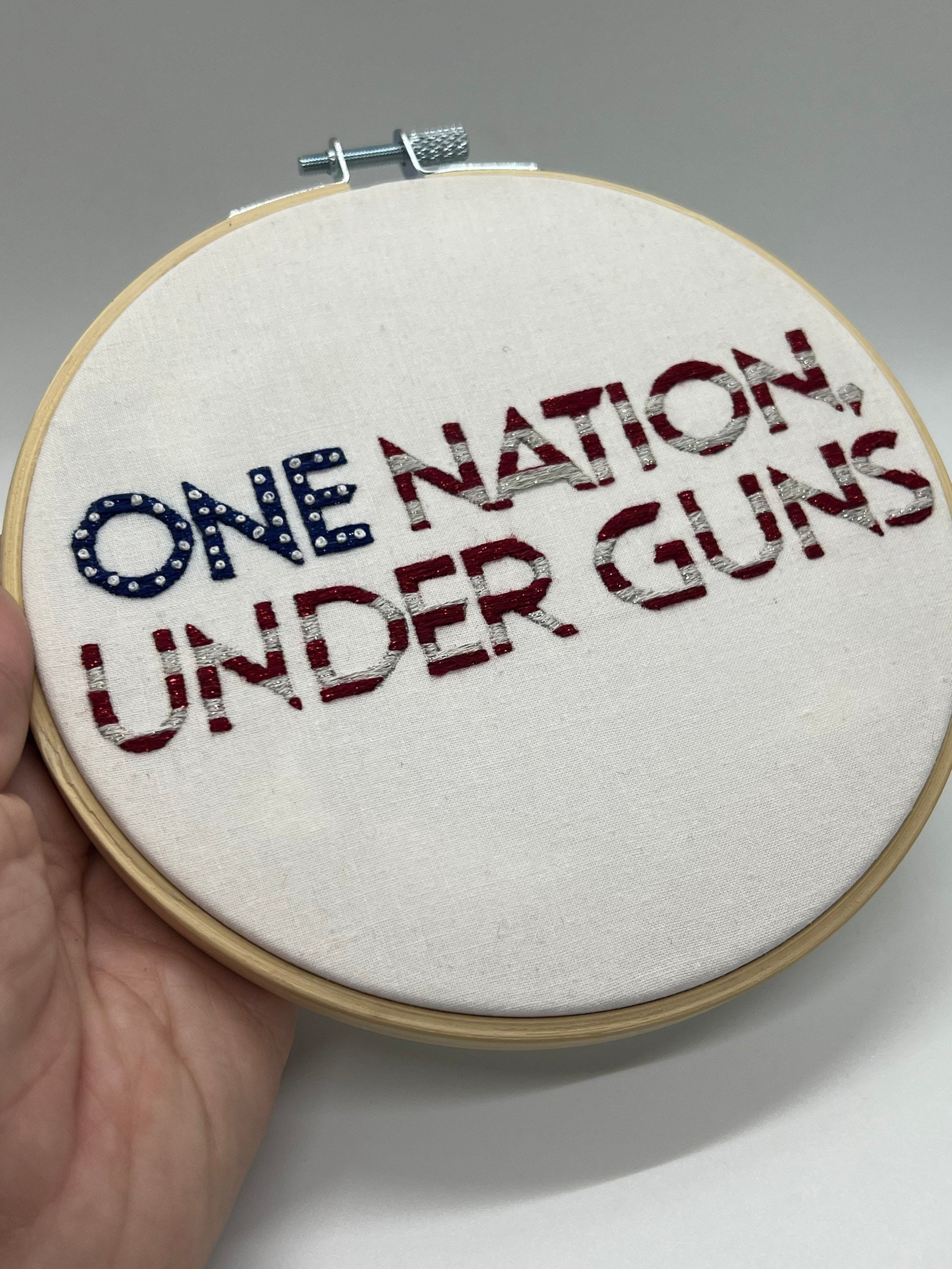 One nation under guns, this is America, Stars and Stripes, gun control hand embroidery