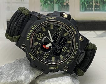 Reloj digital de supervivencia de resina beige y negro de 55 mm con alarma y temporizador y correa de paracord.
