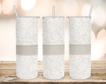 May include: Three stainless steel tumblers with a white lace and burlap design. The tumblers have a straw and a lid.