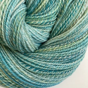 Hand-dyed, 2-ply cotton, thick and thin yarn, 500 yard skeins, in shades of  yellow, lavender, and blue