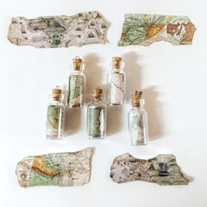 LostWorld line necklaces with green maps from around the world, glass bottle necklaces and antique maps