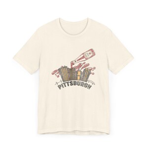 Yinzer Pittsburgh T-Shirt: Dahntahn Skyline Splash - Heinz Ketchup Art, Bella+Canvas Cotton, Unisex Jersey Tee Bild 3