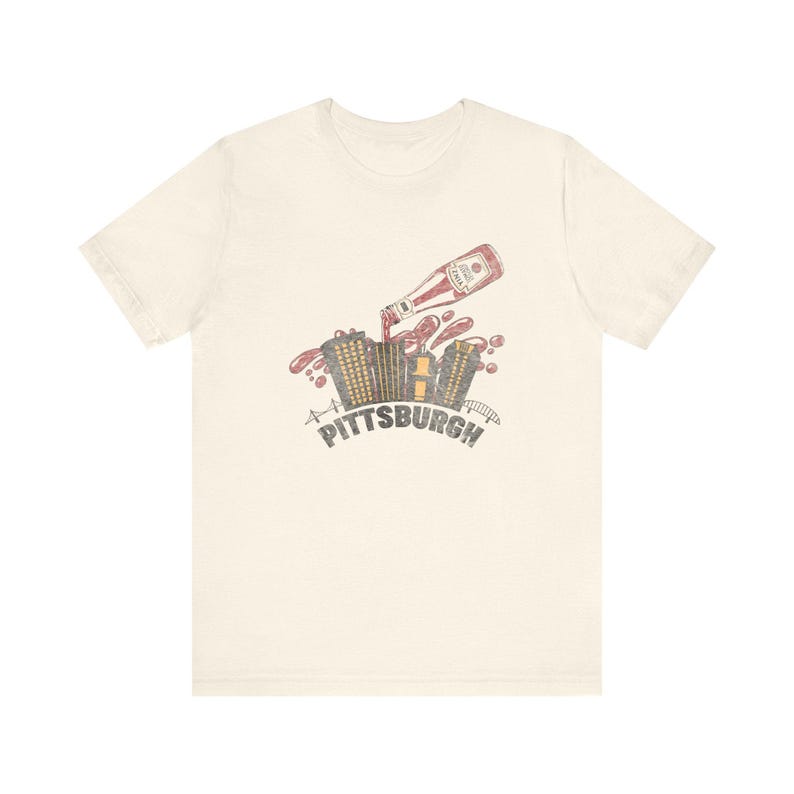 Yinzer Pittsburgh T-Shirt: Dahntahn Skyline Splash - Heinz Ketchup Art, Bella+Canvas Cotton, Unisex Jersey Tee Bild 1