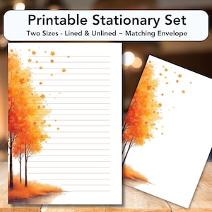 Pode incluir: Conjunto de papelaria imprimível com papel pautado e sem pauta e um envelope a condizer. O design apresenta árvores em aquarela com folhas laranja e amarelas, evocando um tema outonal. O texto no topo diz "Printable Stationary Set" e "Two Sizes - Lined & Unlined ~ Matching Envelope."