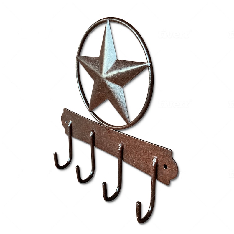 May include: Rustic metal key holder with four hooks and a star-shaped design. The key holder is painted in a brown color.