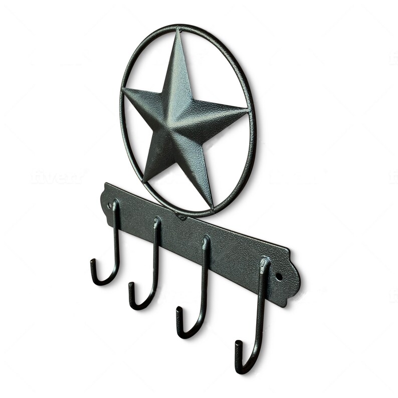May include: Black metal key hook with four hooks and a star-shaped design.