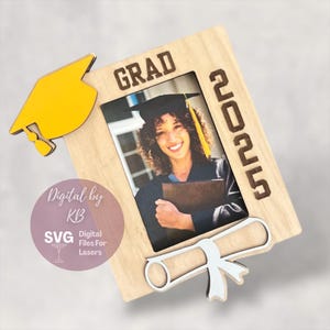 May include: A wooden picture frame with a graduation cap, diploma, and the year 2025. The frame is designed to hold a 4x6 inch photo. The text "GRAD" is printed on the frame.