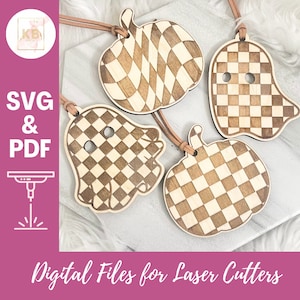 May include: Four wooden ornaments in the shape of pumpkins and ghosts with a checkered pattern. The ornaments are laser cut and have holes for hanging. The text "SVG & PDF" and "Digital Files for Laser Cutters" is visible in the image.