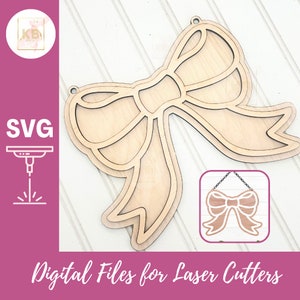 May include: A wooden bow cutout for laser cutting. The bow is a simple design with a single loop and two tails. The bow is shown on a white wood background. The image also includes a smaller image of the bow as it would look when cut out and assembled.