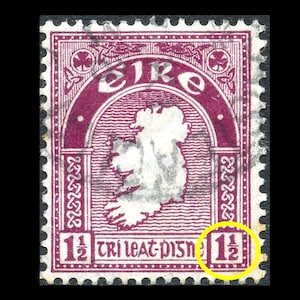 May include: A vintage Irish postage stamp with a purple background and a map of Ireland. The stamp features the text "EIRE" and "1 1/2 TRI LEAT PIST", and the number "1 1/2" is printed in the bottom right corner.