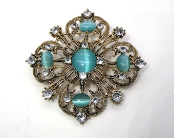 Vintage “Unsigned Beauty” Light Turquoise Cat’s Eye and Rhinestone Collectible Brooch