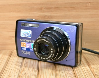 Olympus Stylus 7000 12 MP Digital Camera, 7x Optical Zoom, Dual Image Stabilized, Purple