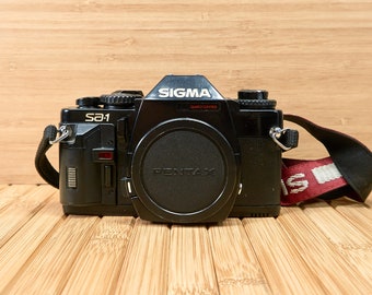 Cámara SLR vintage Sigma SA-1 de 35 mm Pentax K de los años 60, fabricada en Japón