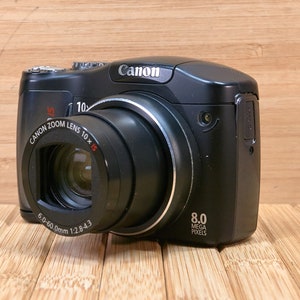 Canon PowerShot SX100IS 8 MP Digital Camera, with 10x Optical Zoom, Image Stabilization, Made in Japan image 1