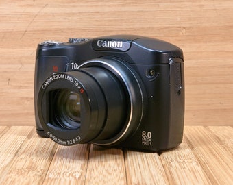 Canon PowerShot SX100IS 8 MP Digital Camera, with 10x  Optical Zoom, Image Stabilization, Made in Japan