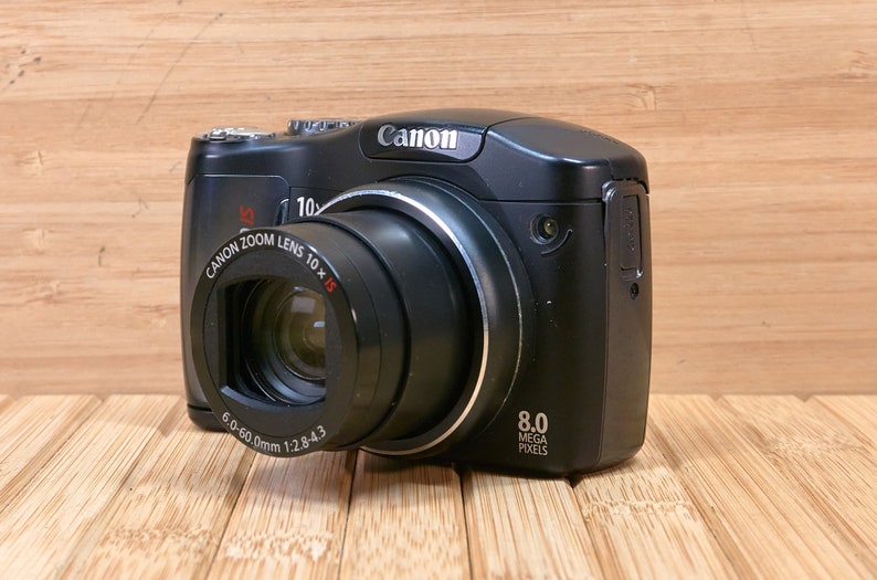 Canon PowerShot SX100IS 8 MP Digital Camera, with 10x Optical Zoom, Image Stabilization, Made in Japan image 1