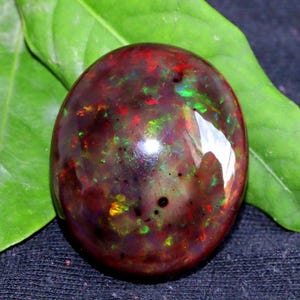 Cabujón de ópalo negro etíope Welo Fire AAA de 24,30 quilates, forma ovalada, piedra preciosa de ópalo natural suelta para la fabricación de joyas.