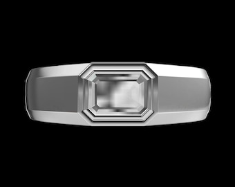 May include: A silver ring with a clear, rectangular-shaped gemstone set in a bezel setting.