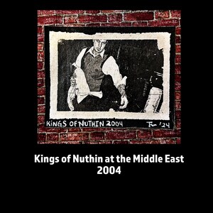 May include: Black and white photo of a musician performing on stage at the Middle East in 2004. The photo is framed and mounted on a brick wall. The text "Kings of Nuthin 2004" is written below the photo.