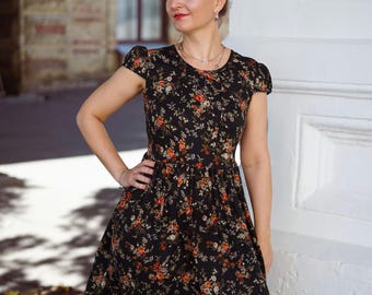 Sukienka letnia w kwiaty w kolorze czarnym z kieszeniami, elastycznymi krótkimi rękawami i wiązaniem z tyłu, sukienka midi w stylu boho z wiskozy na wiosnę