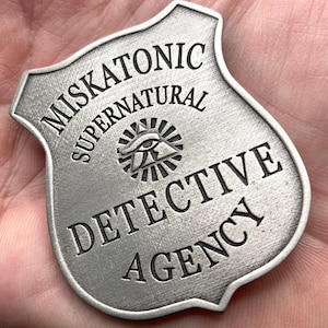 Insignia OFICIAL de la Agencia de Detectives Sobrenaturales de Miskatonic