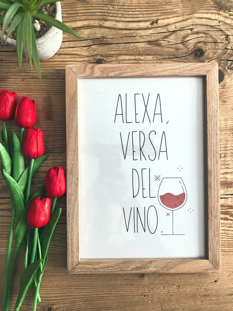 May include: A framed print with the text "Alexa, versa del* vino."  The print features a black and white illustration of a glass of red wine.