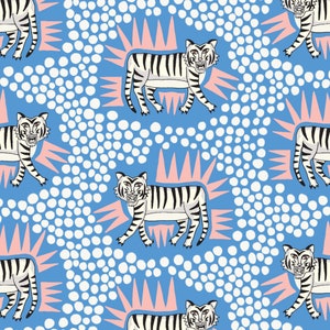 May include: A seamless pattern featuring white tigers with black stripes on a light blue background. The tigers are surrounded by pink and white sunburst shapes and white polka dots.