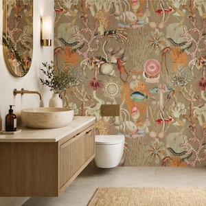 May include: A bathroom interior with a beige and brown colour scheme. The focal point is a wall covered in a sea life pattern, featuring coral, fish, and other marine creatures. A wooden vanity with a stone sink and a white toilet complete the scene.