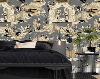 May include: A black bed with a gray headboard and a black bench at the foot of the bed. The wall behind the bed is covered in a gray wallpaper with a black and white chinoiserie pattern.
