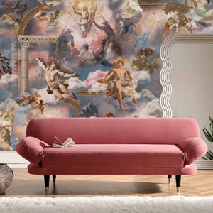 May include: A pink velvet sofa with a tufted back and armrests. The sofa has a wooden frame and legs. The sofa is in front of a wall with a mural depicting a scene from the Renaissance.