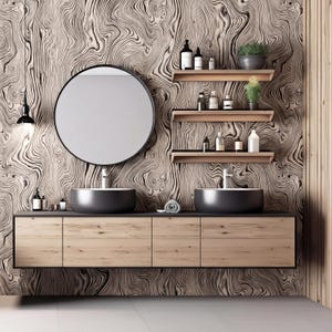 May include: Modern bathroom vanity with a large round mirror, two dark gray vessel sinks, and wooden cabinets. The wall features a swirling wood grain pattern, with floating shelves holding toiletries and plants. A black light fixture hangs from the ceiling.