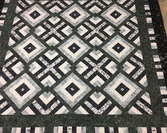 King size 100 x 100 handmade quilt that is mostly grays and off white, and 100 percent cotton in a geometric pattern.