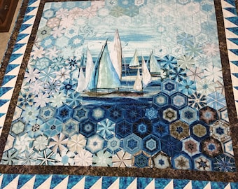 King size One Block Wonder ‘Sail boat’ handmade quilt that measures 97 wide and 98 inches long.  Colors are mostly blues and off white.