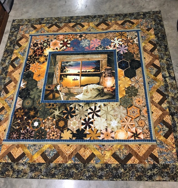 King size One Block Wonder fishing themed handmade quilt that’s 100 percent cotton and sewn and quilted on my domestic sewing machine.