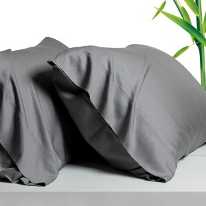 May include: Two gray pillowcases made of soft, breathable bamboo fabric. The pillowcases are wrinkle-resistant and hypoallergenic.