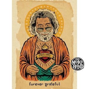 May include: Illustration of a man with sunglasses, a beard, and an orange robe, with a heart-shaped tattoo that reads "1942-1995." The text "forever grateful" is at the bottom. A yellow halo surrounds the man's head. The Mojo Hand logo is in the corner.
