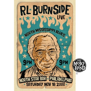 May include: A vintage-style poster advertising a live performance by RL Burnside, a North Mississippi Blues musician. The poster features a cartoon illustration of Burnside with the text "RL Burnside Live" and "North Mississippi Blues" in a bold, black font. The poster also includes the date and location of the performance: "Saturday Nov 18 2000" and "North Star Bar Philadelphia".