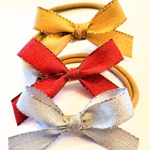 Three shimmering  headbands.