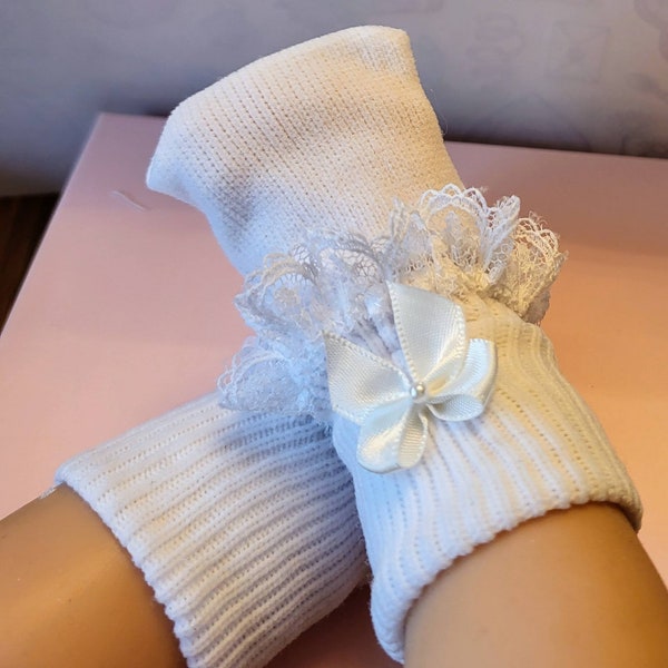 Preemie white lace socks and bow.