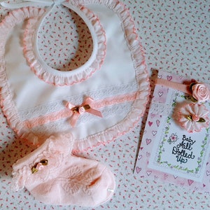 newborn bib set with bib, headband and socks.