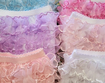 Embroidered ruffled diaper covers, bloomers, for infants, babies, toddlers and girls in pastel colors.