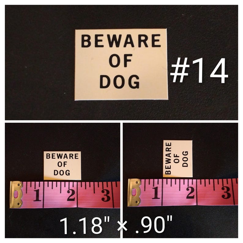 May include: A rectangular sign with the text "BEWARE OF DOG" in black capital letters. The sign is cream-colored and measures 1.18 inches by 0.90 inches. The number "#14" is in white. The sign is on a black background.